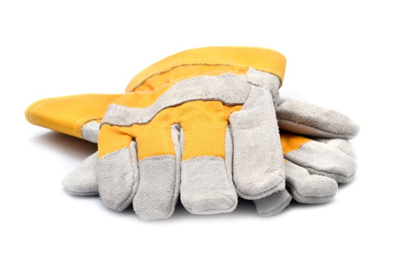 A pair of modern yellow and gray construction gloves